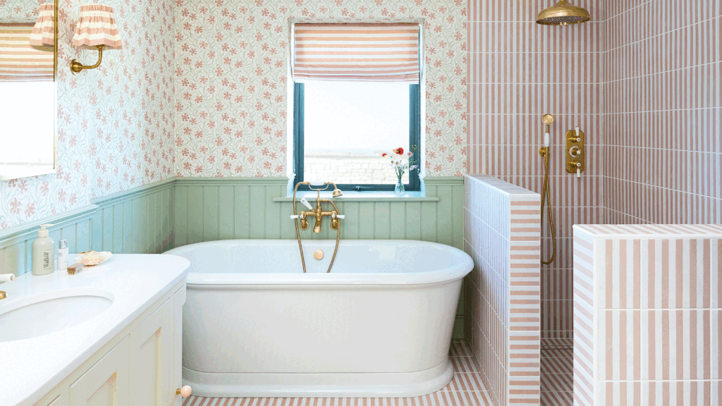 This bathroom took a risk mixing patterned tiles and wallpaper
