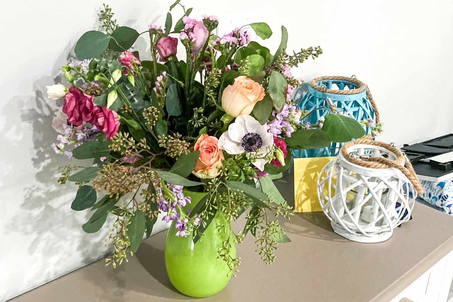 A Farmgirl Flowers in a green vase