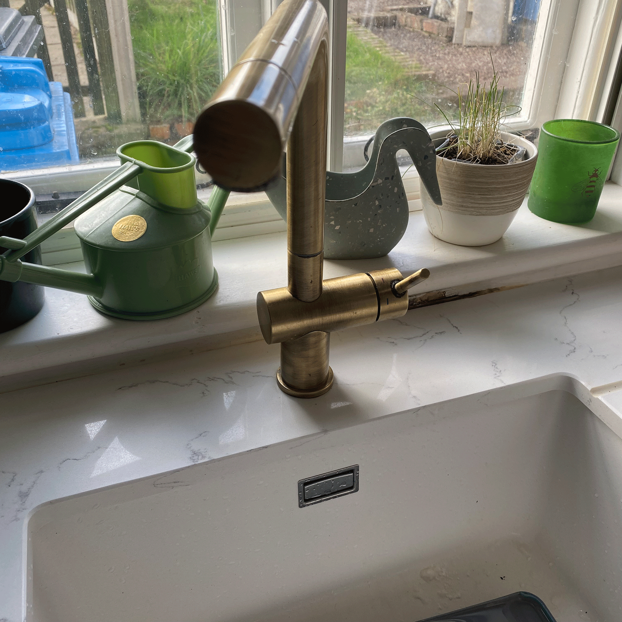 Kitchen sink with wall damage