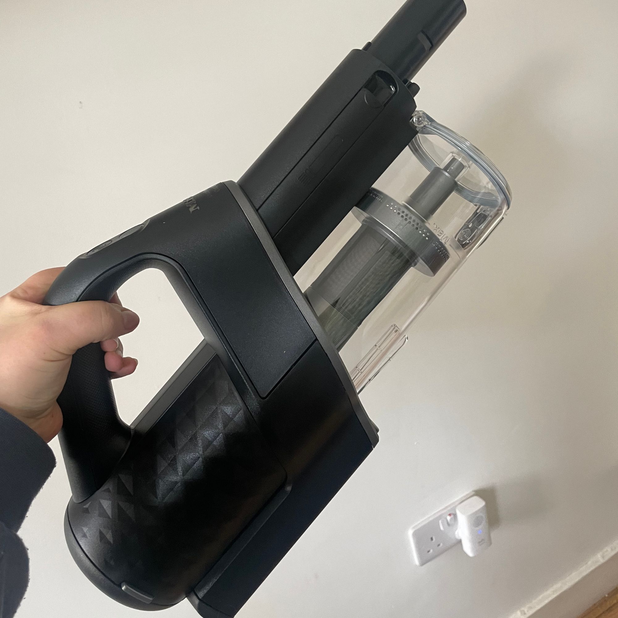 Holding up the handheld section of the Miele DuoFlex HX1