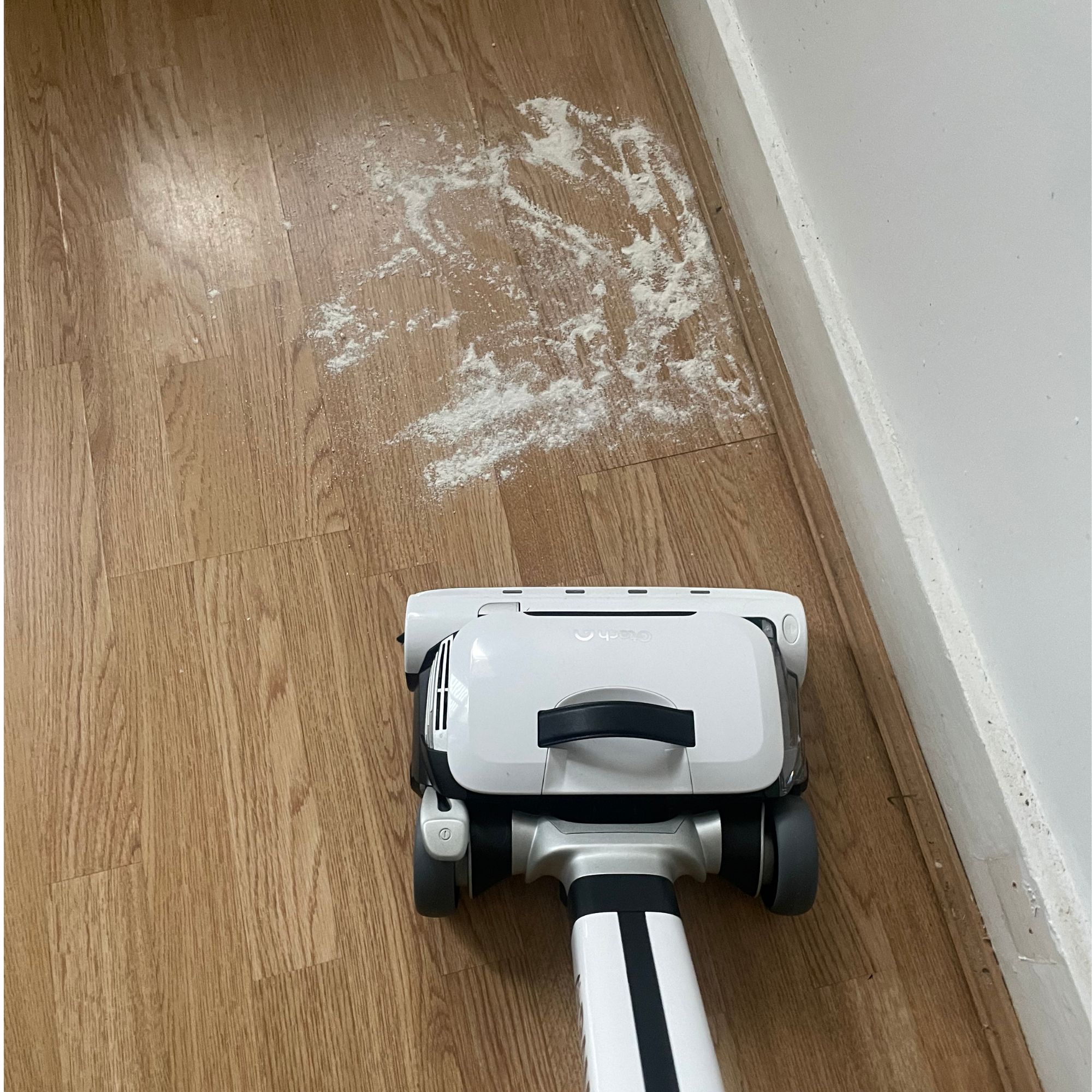 gtech airram 3 on hardwood floor with flour and sugar