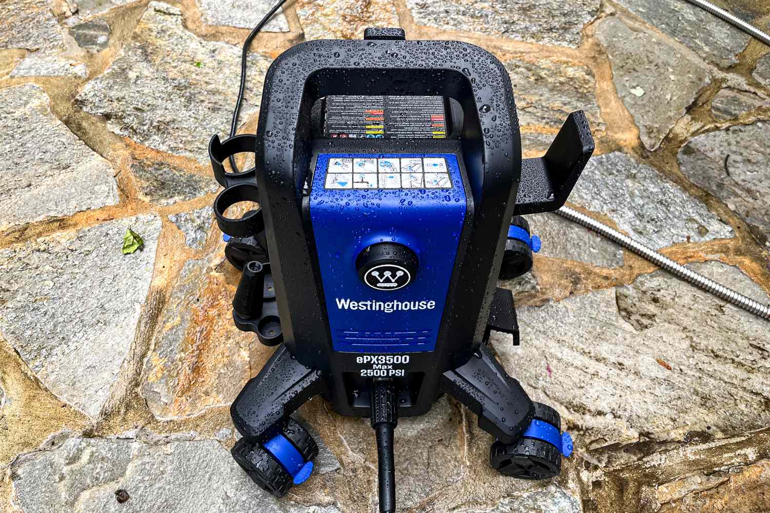 The Westinghouse ePX3500 Electric Pressure Washer on a stone patio