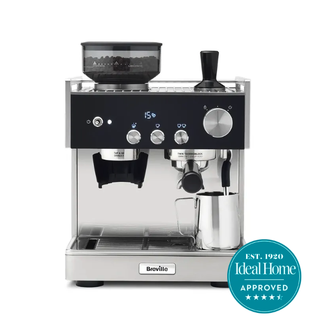 Black and stainless steel Breville coffee machine with a milk jug and frother 