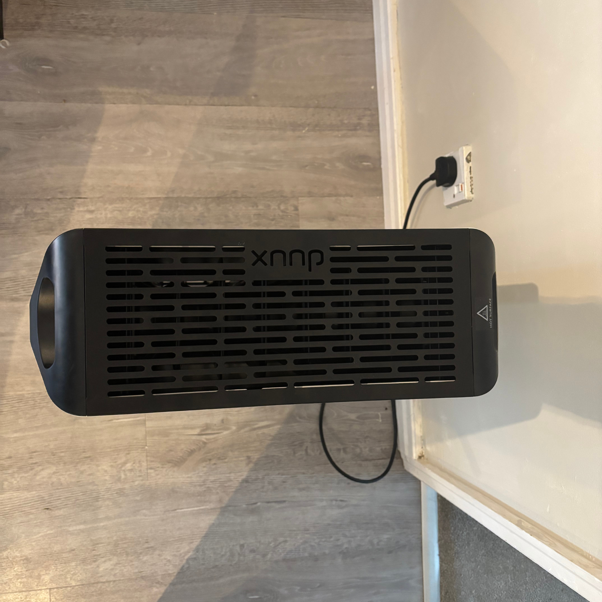 Overhead view of the Duux Edge Oil 2000W Oil-Filled Radiator showing black top vent