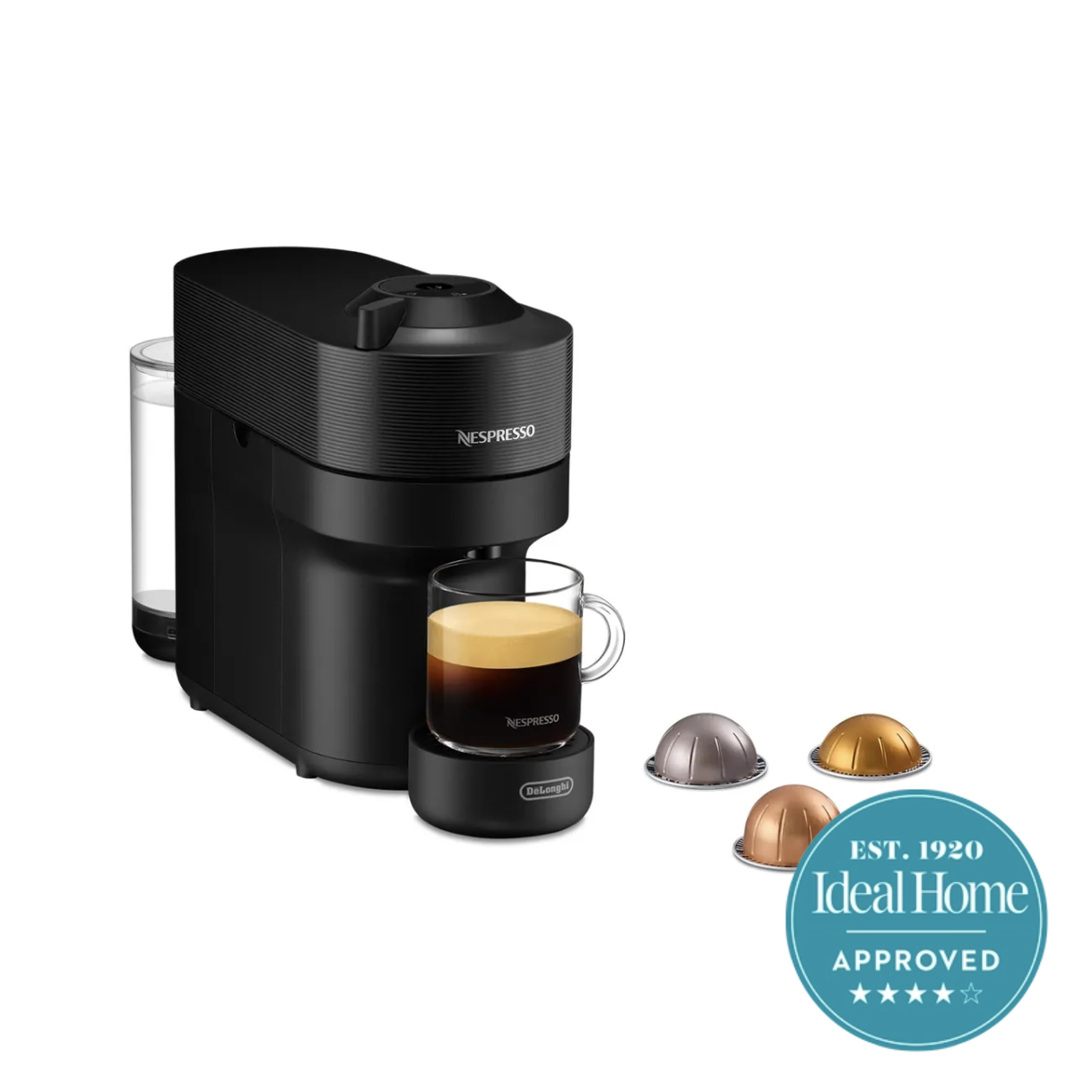 A slim Black Nespresso machine with an americano under the spout and three pods alongside