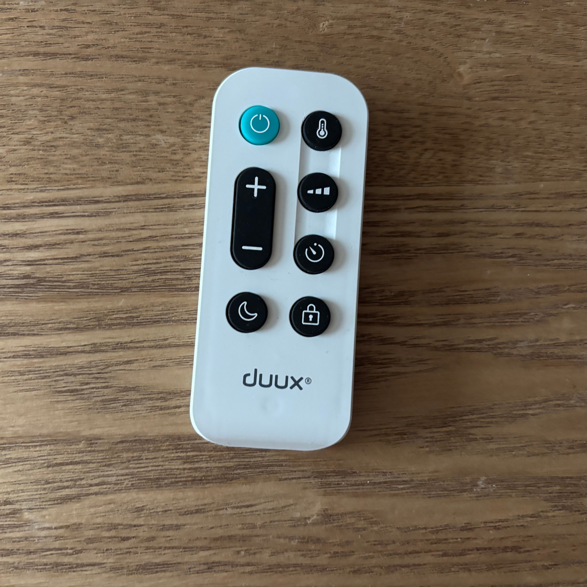 Duux Edge Oil 2000W Oil-Filled Radiator white remote control with black buttons