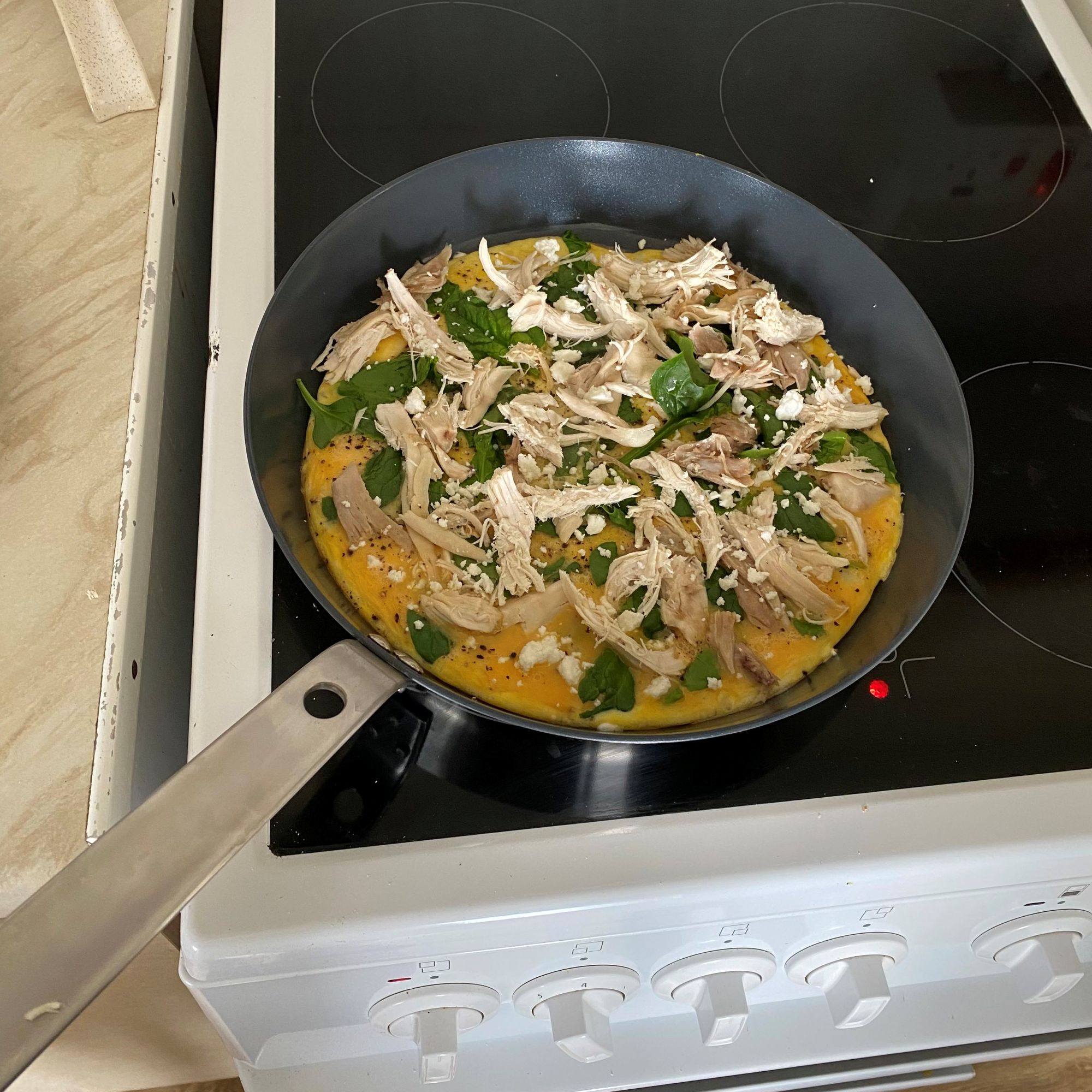 omelette cooking in IKEA HEMKOMST frying pan