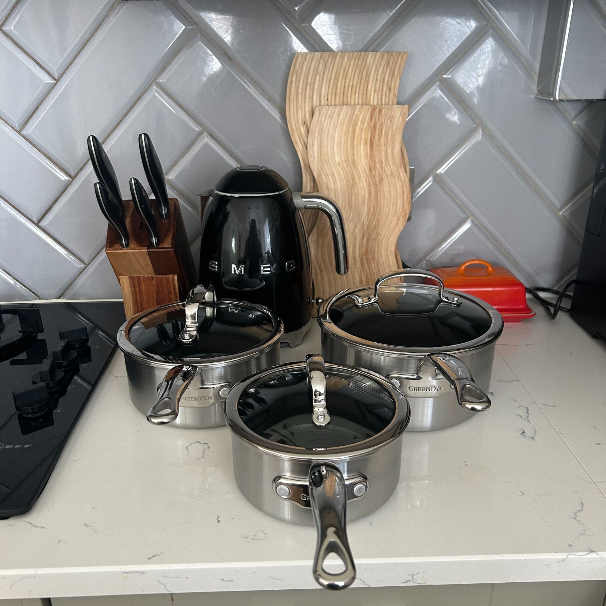 GreenPan Premiere Stainless Steel Ceramic Non-Stick Saucepan & Lid Set, all pieces on kitchen worktop