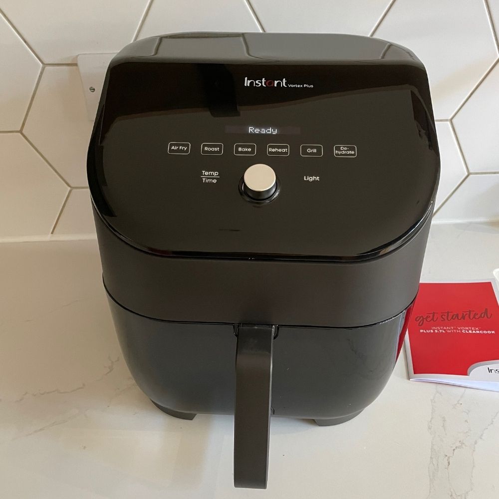 Instant Vortex Plus 6-in-1 Air Fryer control panel with instruction manual