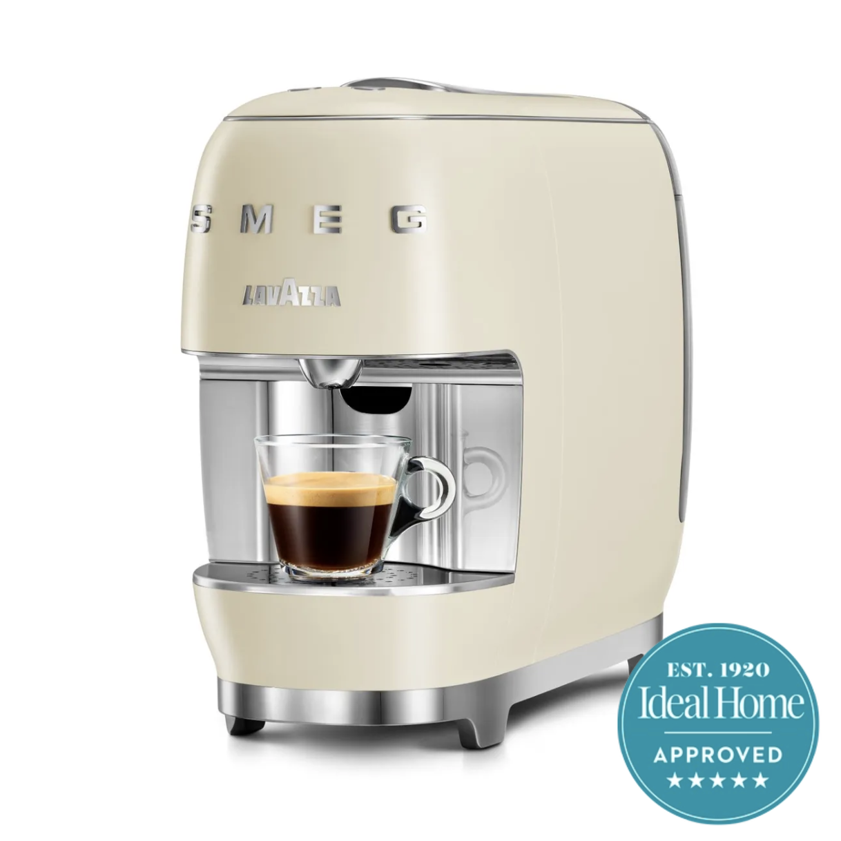 Cream pod coffee machine with rounded sides and SMEG lettering dispensing an espresso