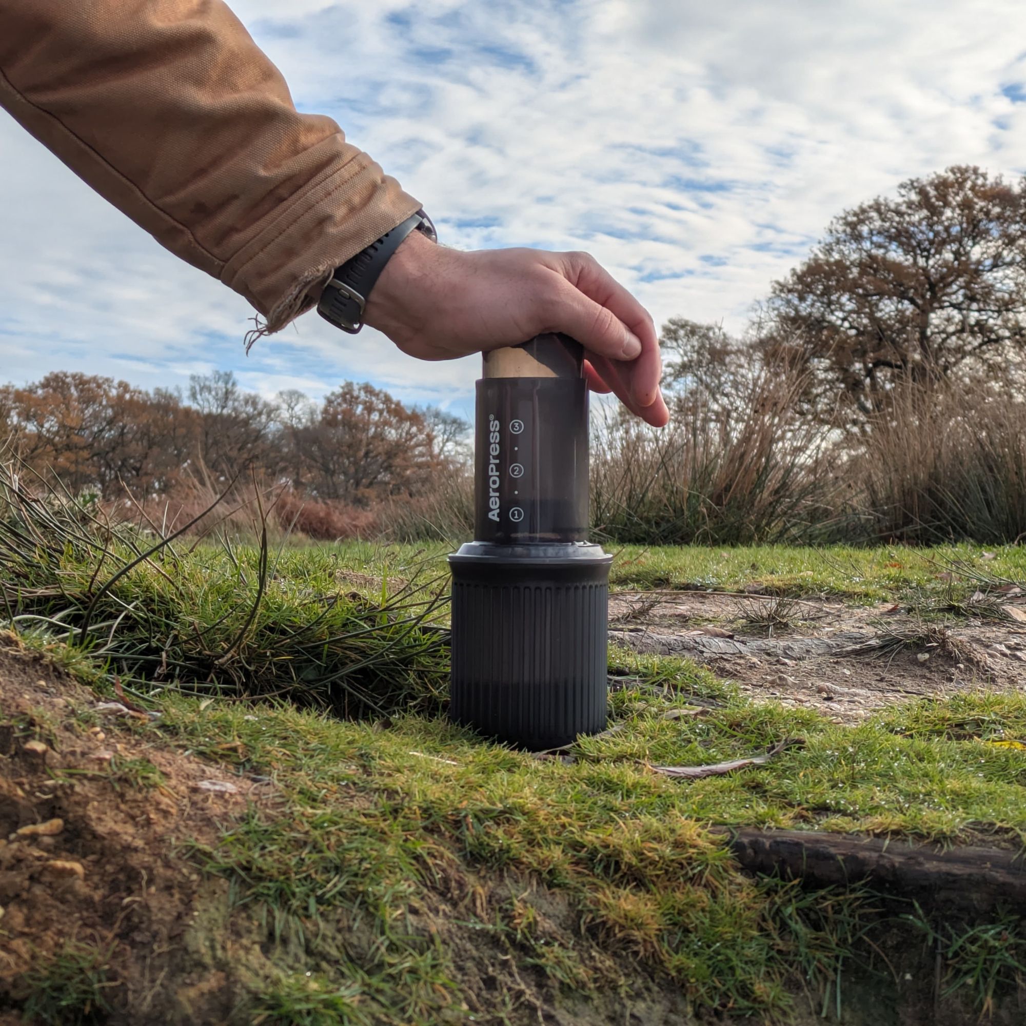 Pressing the plunger on the Aeropress Go