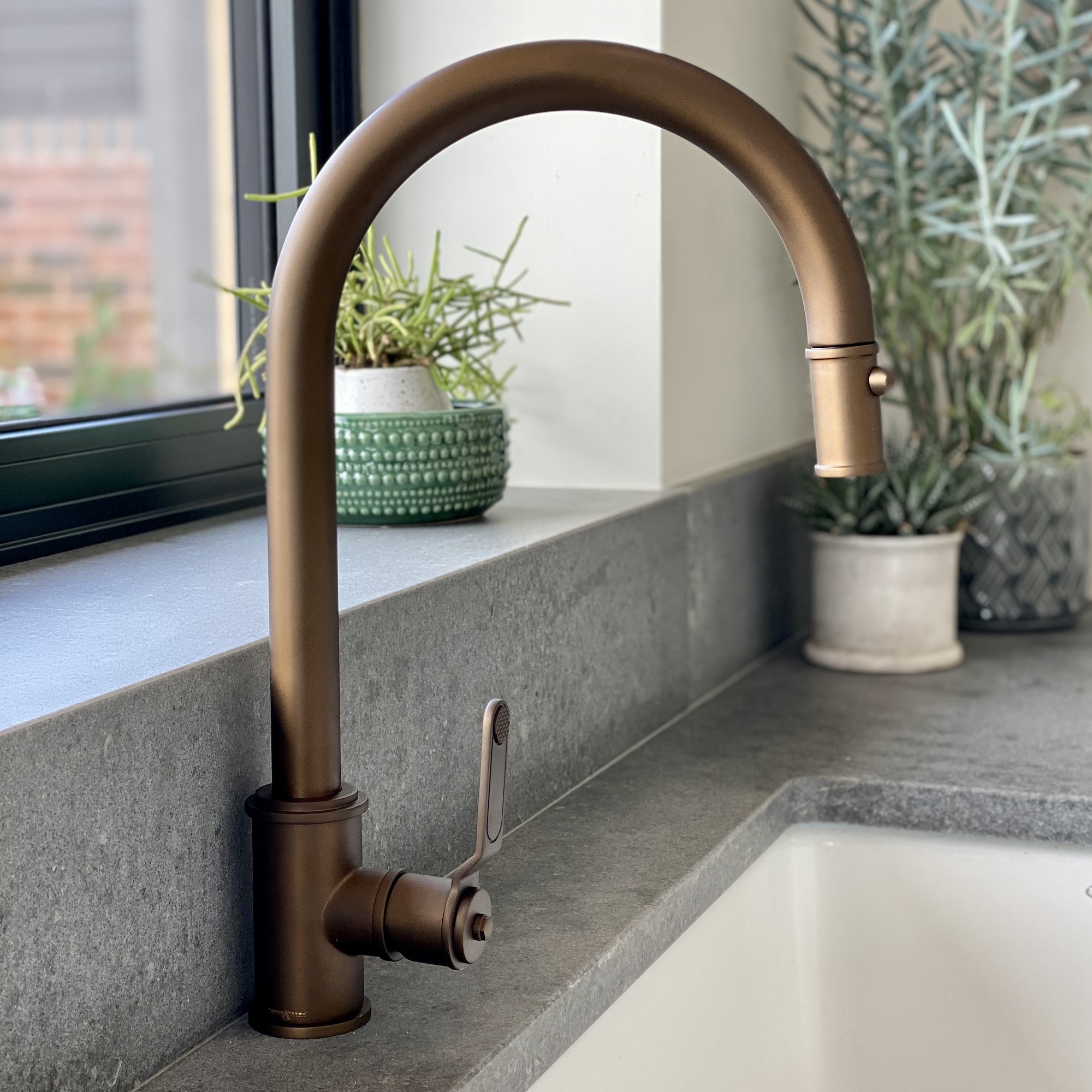 Brass boiling water tap in kitchen