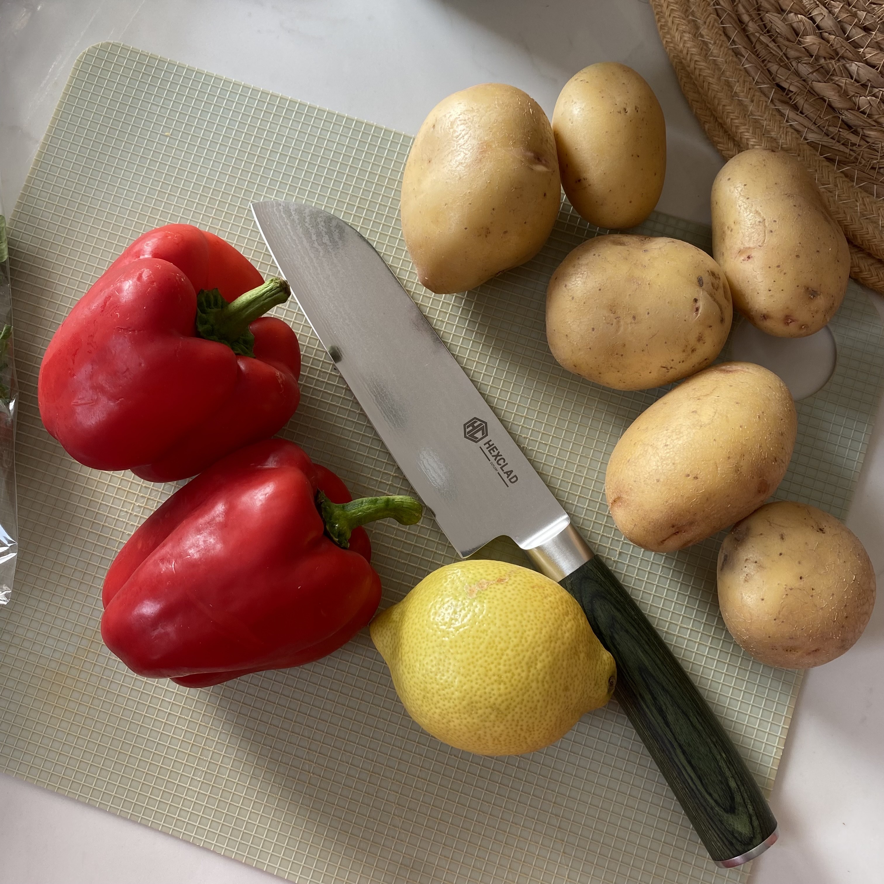 The HexClad Santoku blade being used in kitchen