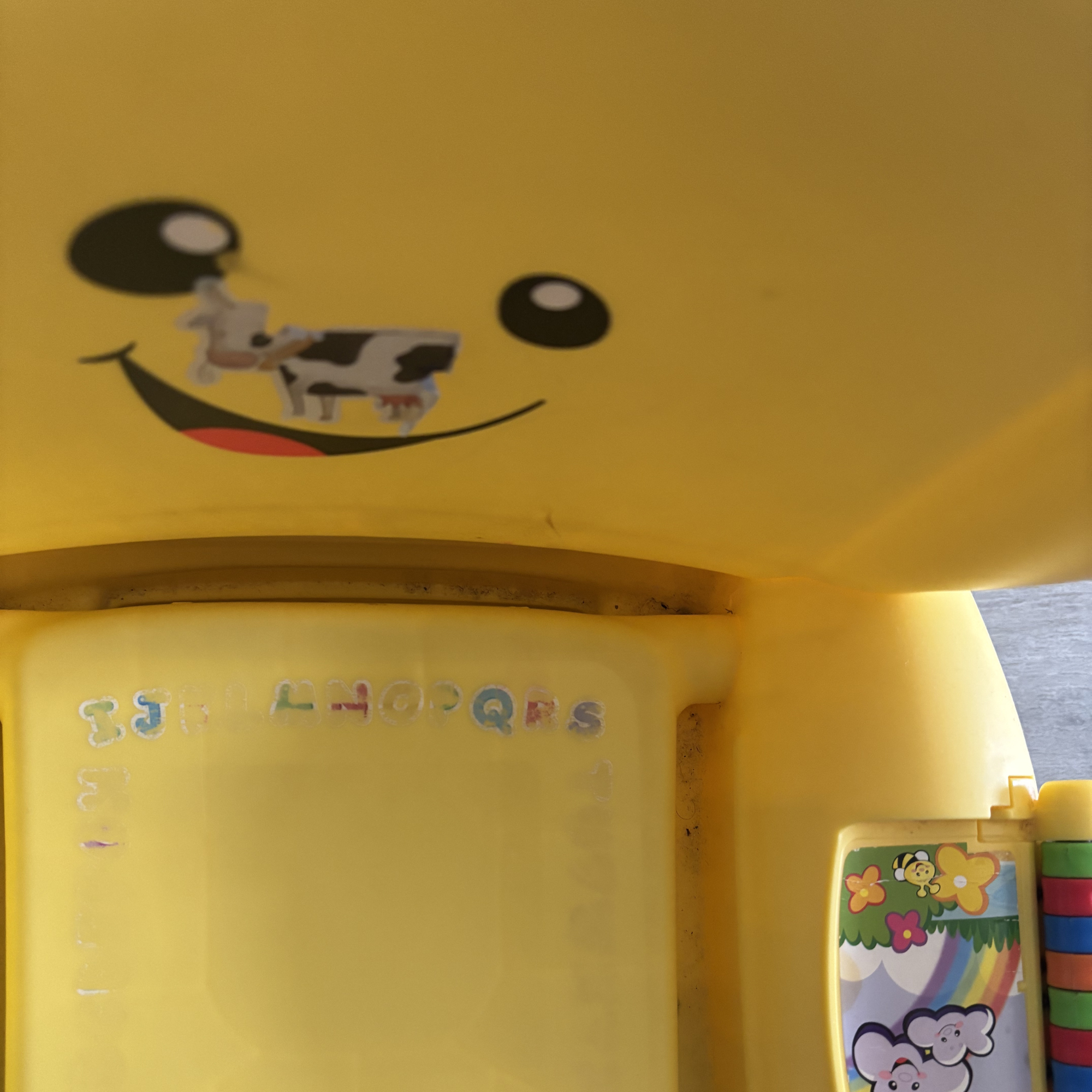 Yellow plastic kids chair before using the Beldray Digital Handheld Steam Cleaner