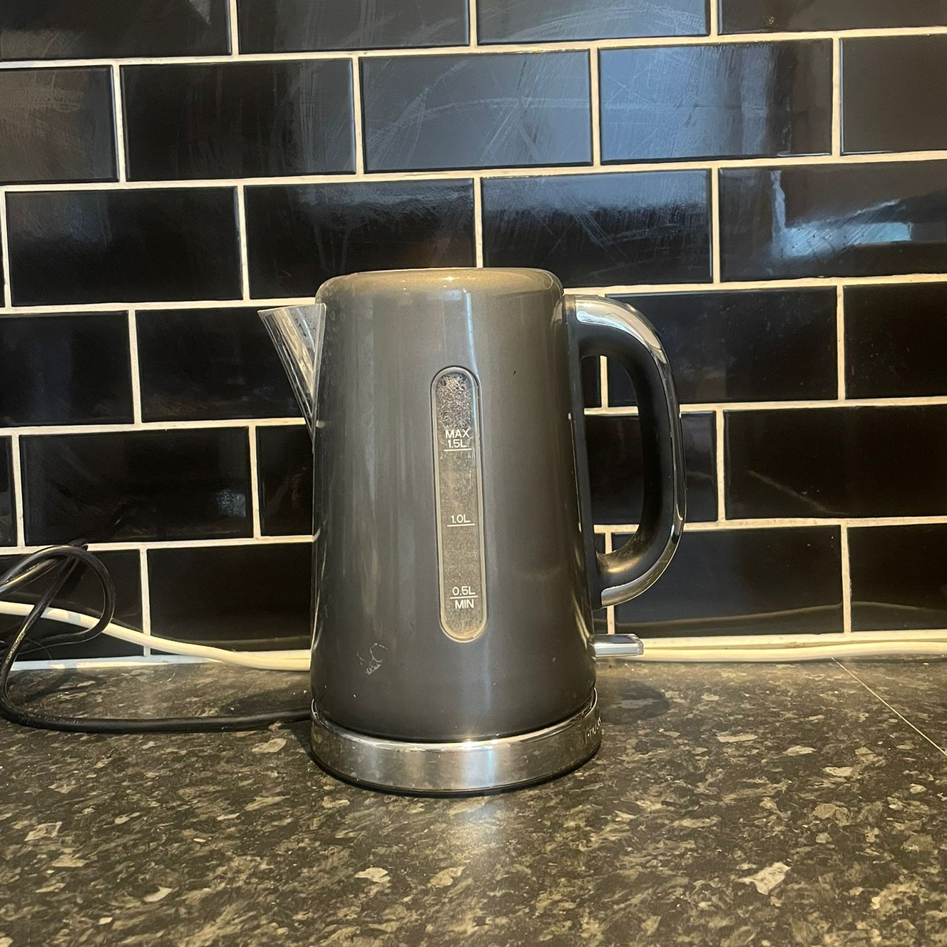 A grey ProCook kettle on a marble worktop 