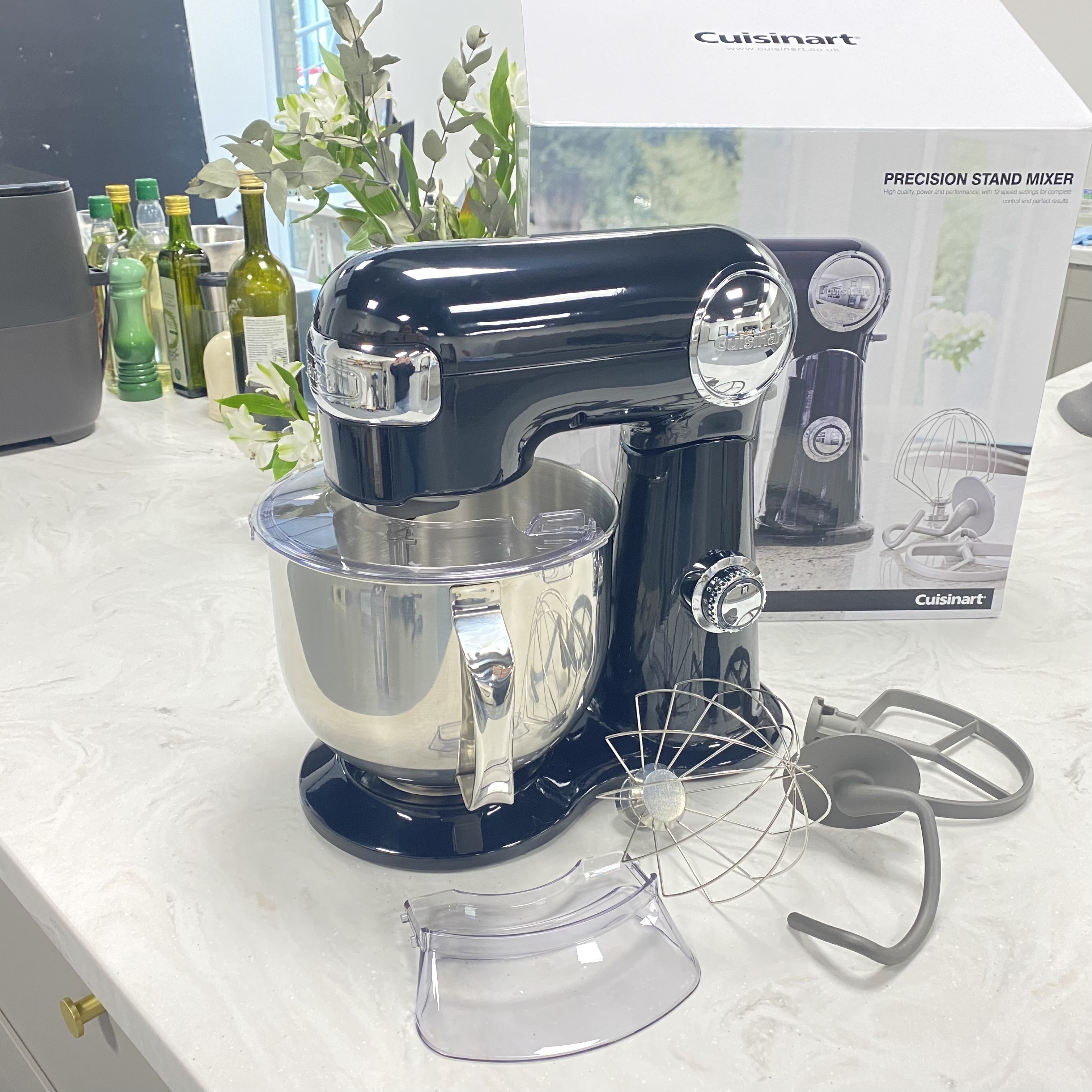 Testing a black Cuisinart mixer on a marble countertop