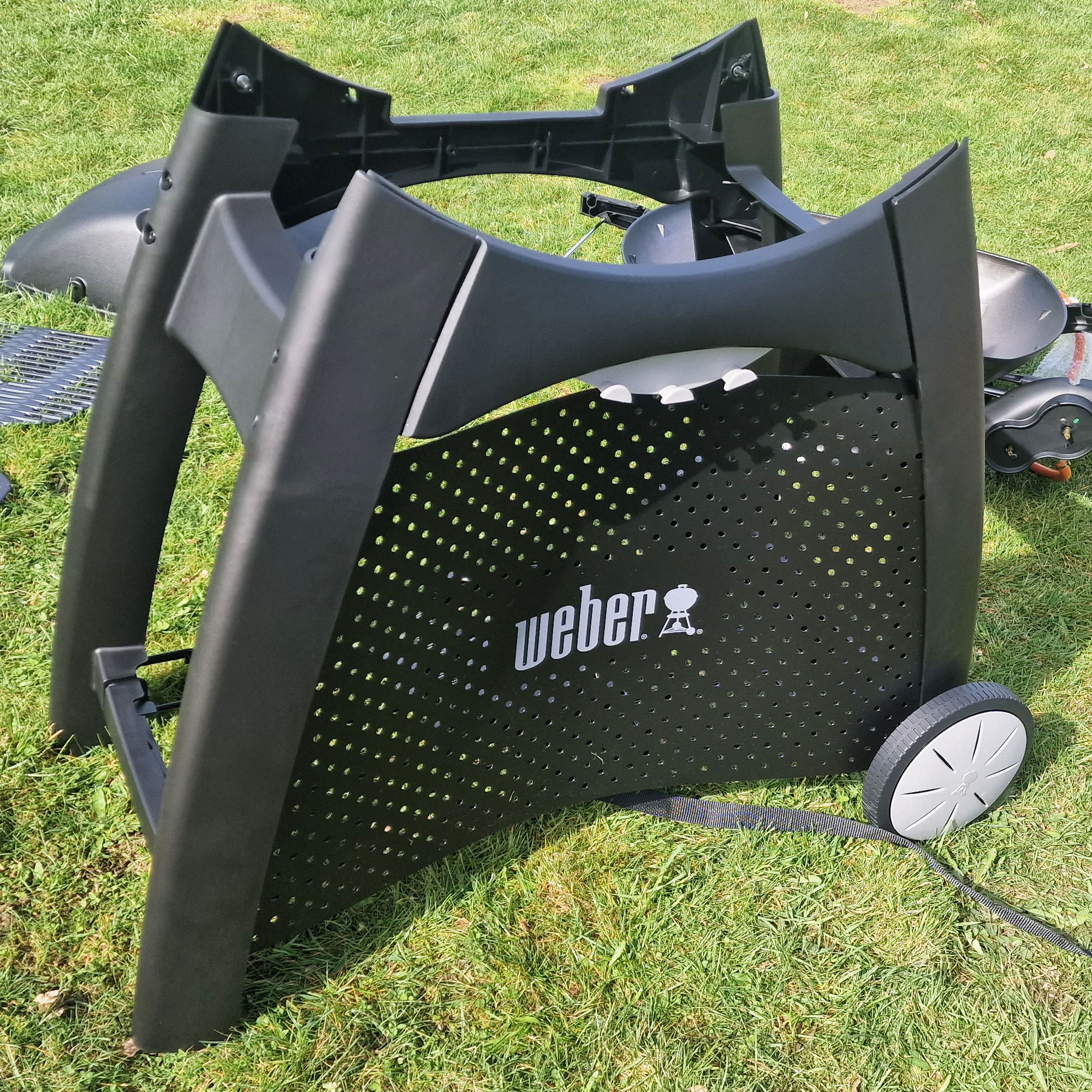 The Weber Q3200 BBQ being assembled