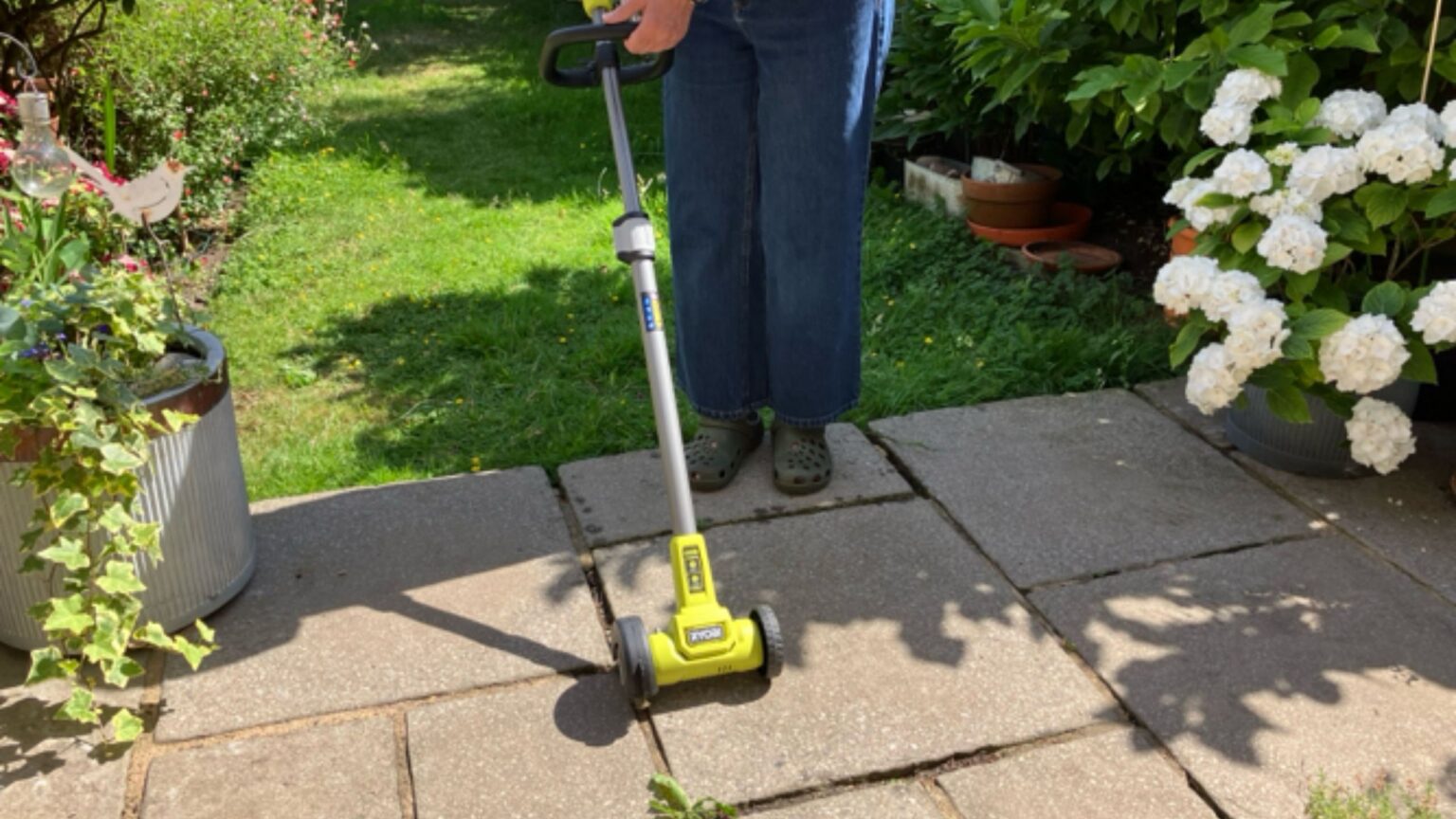 The Ryobi cordless patio cleaner made weeding so easy