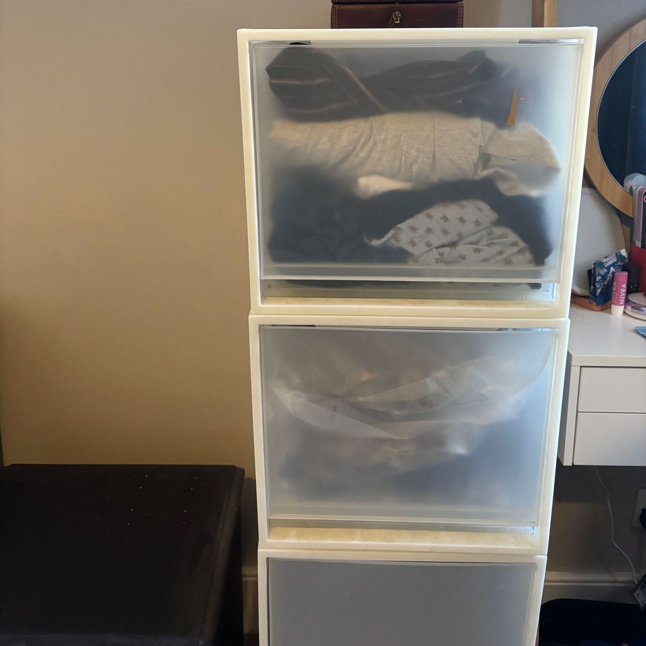 Plastic storage boxes filled with clothes